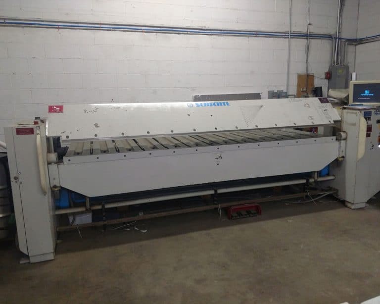 Long computerized sheet metal folder with its control screen in a fabrication shop