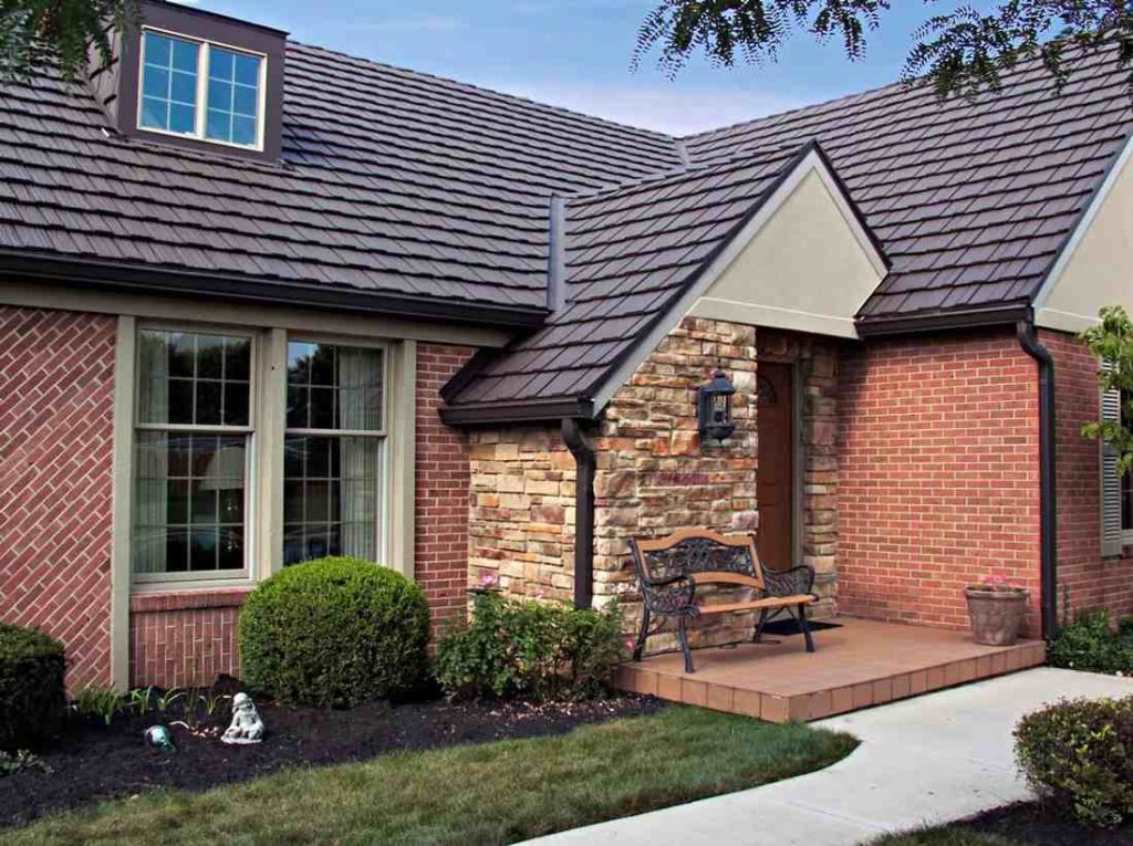 Country Manor Shake aluminum shingle roof on a brick home with a stone entry